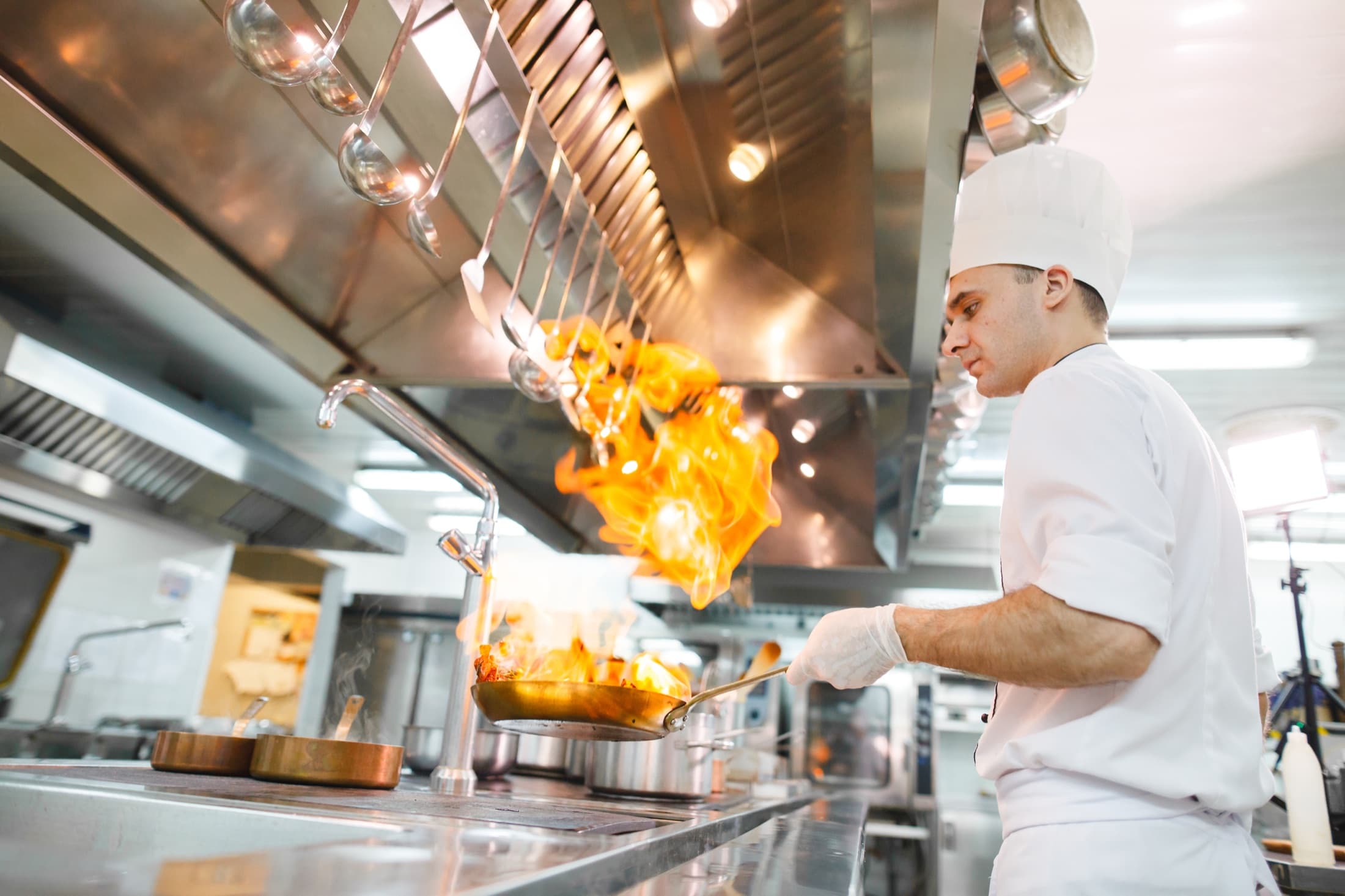 Commercial kitchen exhaust hood being cleaned